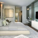 Dormitorio con espejo y tv
