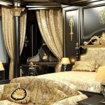 Interior de dormitorio en negro y dorado.