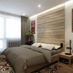 Decoración de madera en la pared a la cabecera de la cama.