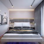 Lámparas en la pared junto a la cama
