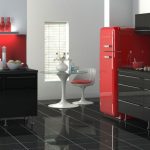 Nevera roja y muebles grises en la cocina.