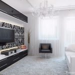 Sofá blanco y sillón negro en la sala de estar