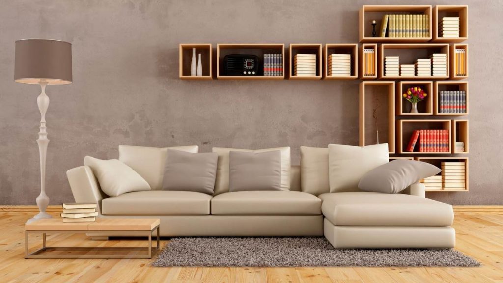 Mga librong nasa pader sa likuran ng sofa