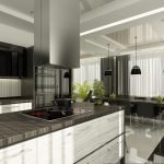 Isla de mesa con cocina eléctrica en la cocina.