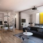 Sofá negro y mesa blanca en la sala de estar