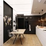 Cocina-comedor con muebles en blanco y negro.
