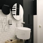 Espejo redondo en el baño.