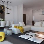 Sillón amarillo y sofá blanco en la sala de estar.