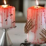 Velas sangrientas con uñas y manos.