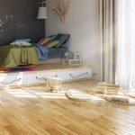 Lámpara de una rama sobre la cama