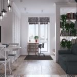 Mesa con sillón junto a la ventana