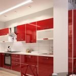 Cocina con interior blanco y muebles rojos.