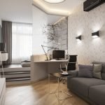Particiones entre dormitorio y sala de estar con escritorio de computadora