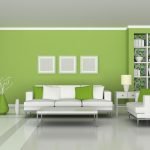 Estantes blancos en una pared verde