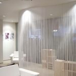 Cortinas para zonificar la habitación.
