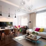 La combinación de un delantal negro y muebles blancos en la cocina.