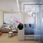 Dormitorio y sala de estar en una habitación.