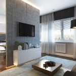 La combinación de un delantal negro y muebles blancos en la cocina.