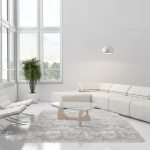 Sala de estar en blanco con una gran ventana de esquina