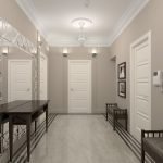Muebles negros en el diseño de un pasillo blanco.