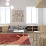 Tonos beige y gris en el interior de una sala blanca.
