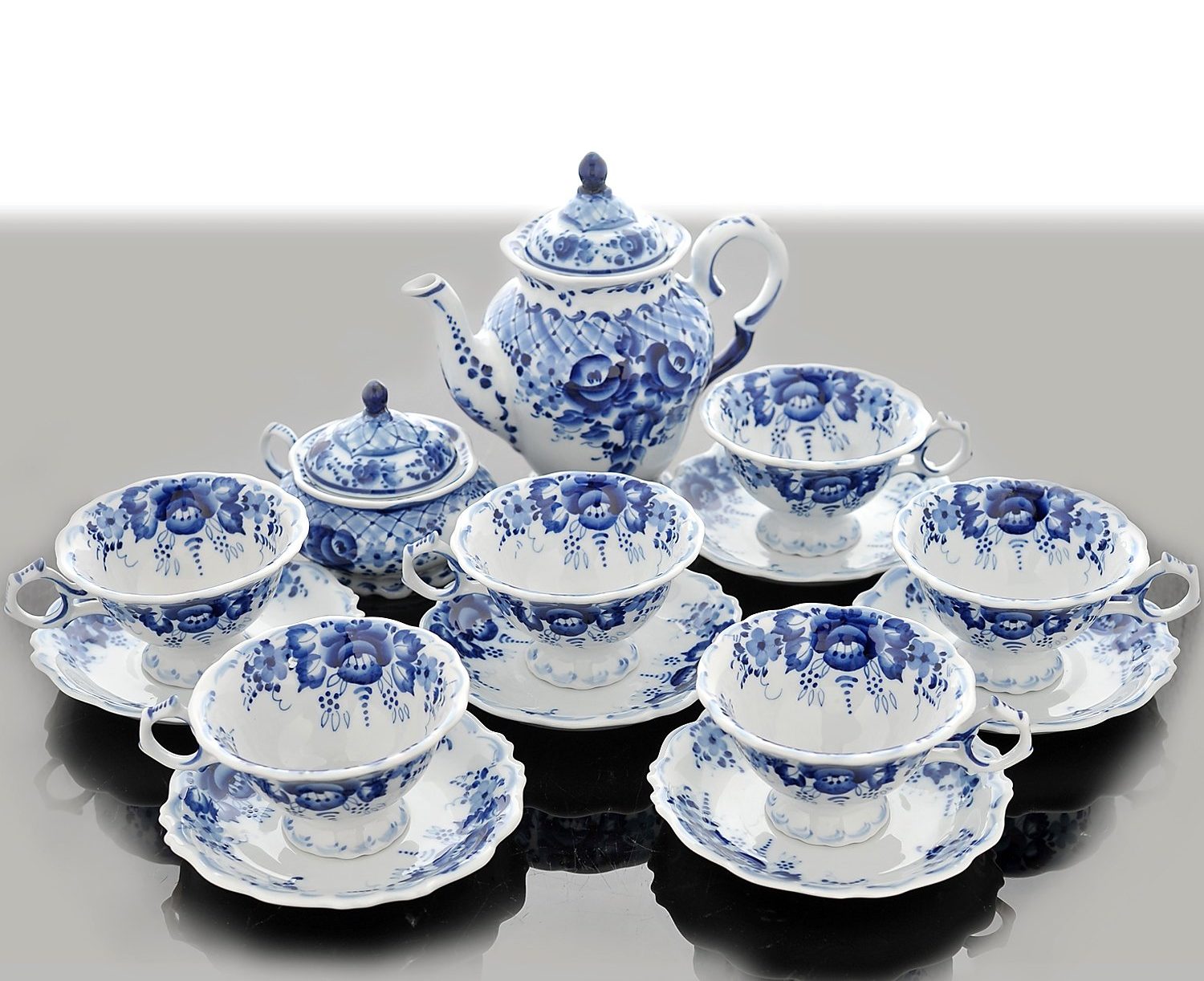 Tazas, platillos, azucarero y tetera estilo Gzhel