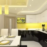 Cocina en blanco y negro con detalles en amarillo.