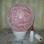 Pega la pelota con hilo