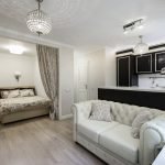 Salón con cama y sofá.